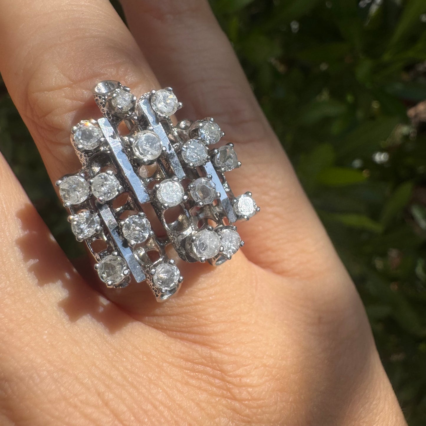 14K gold ring with a geometric design, set with multiple round Diamonds that create a sparkling, structured look.