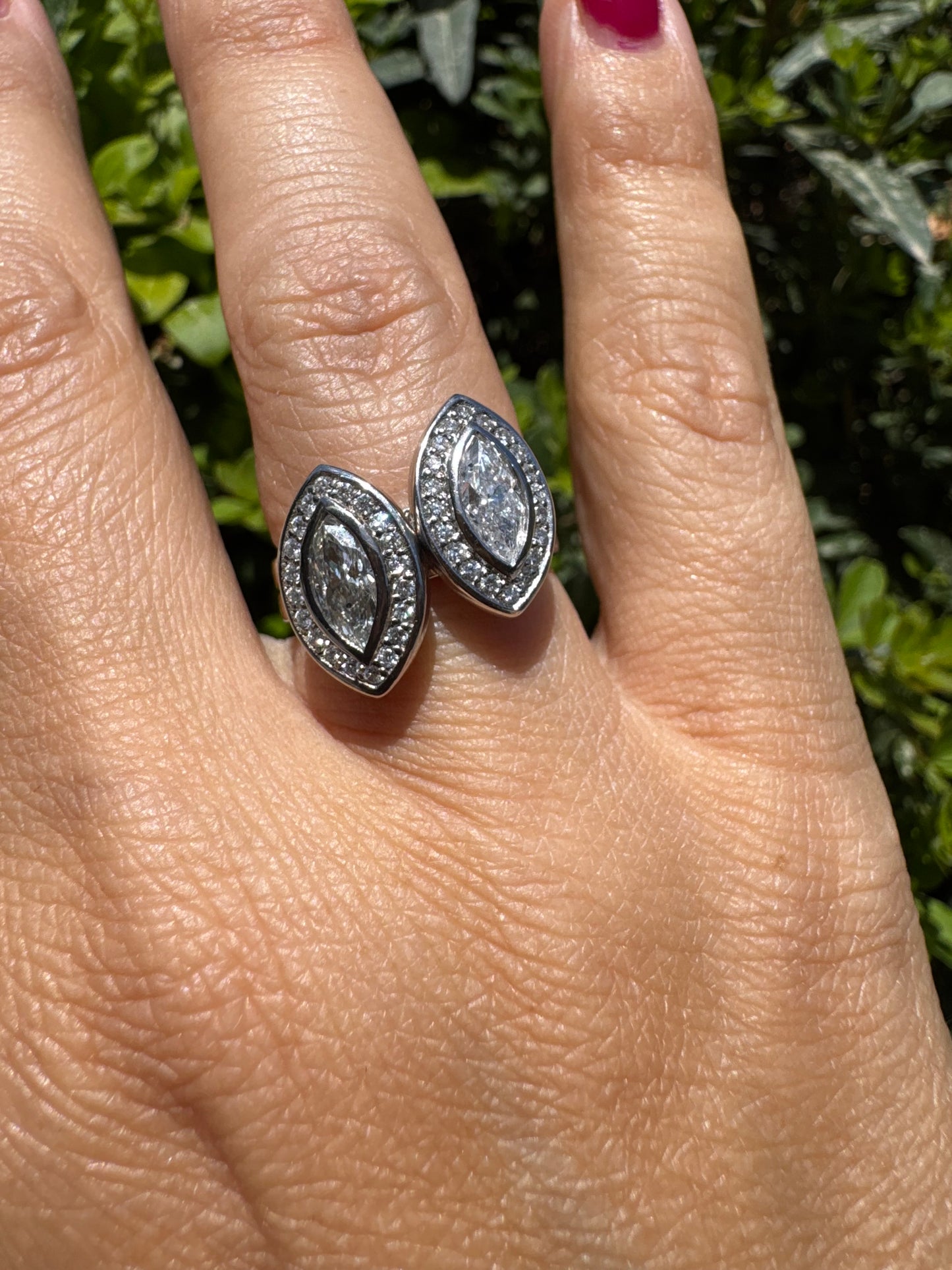 18K gold convertible ring set with two marquise-cut diamond halos that magnetically connect into a bold statement piece