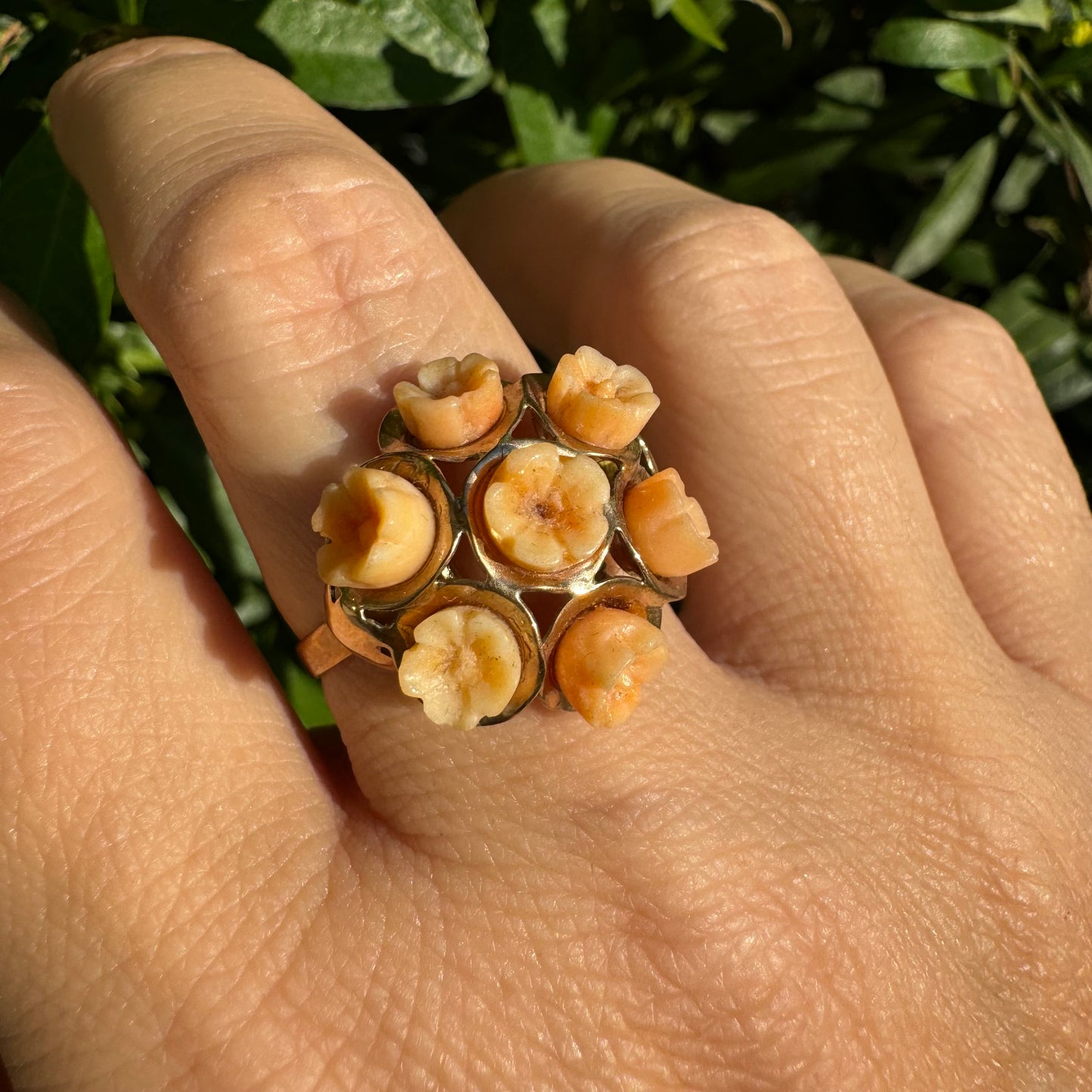 9K gold ring featuring a cluster design with carved Coral flowers in warm orange tones