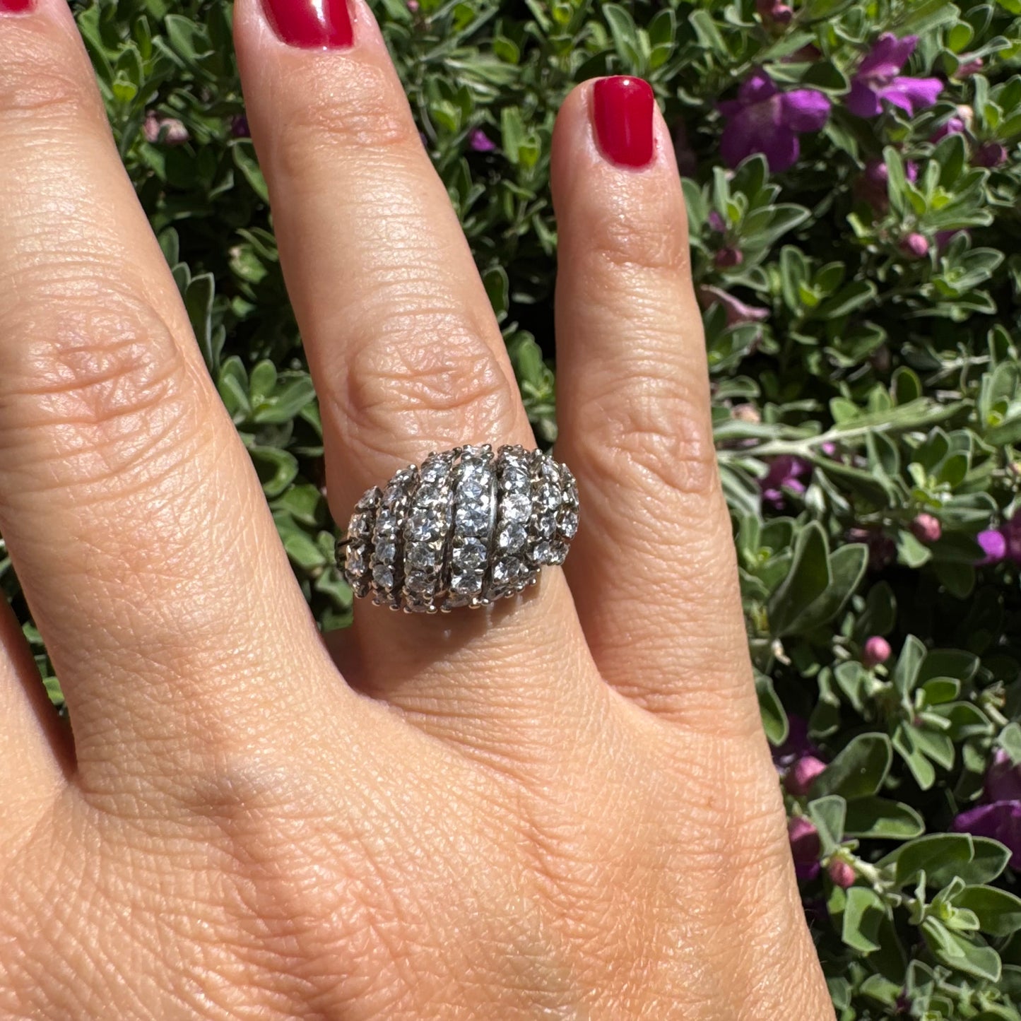 18K gold ring set with rows of sparkling Diamonds in a bold, sculptural design