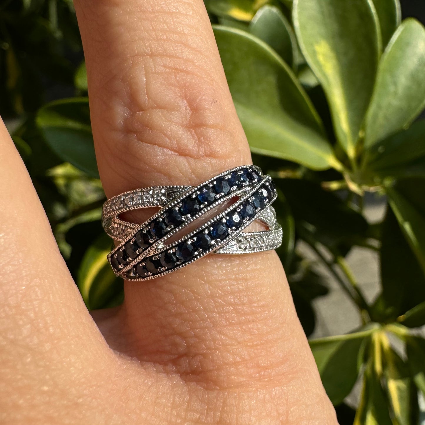 14K gold crossover ring set with Sapphires and sparkling Diamonds