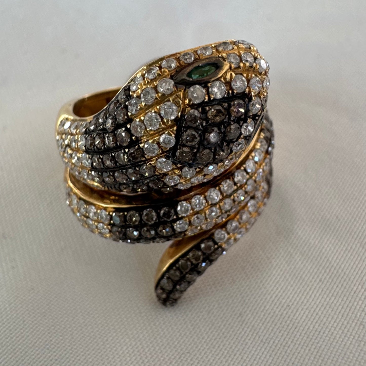 14K gold snake ring fully set with white and black Diamonds, creating a striking contrast and luxurious sparkle.