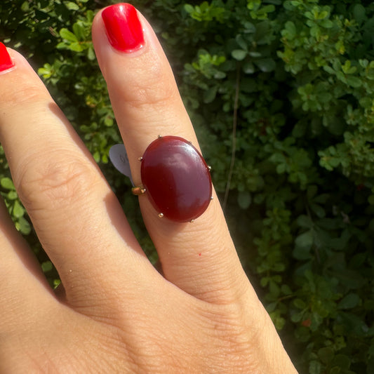 14K gold ring set with a glowing oval Carnelian