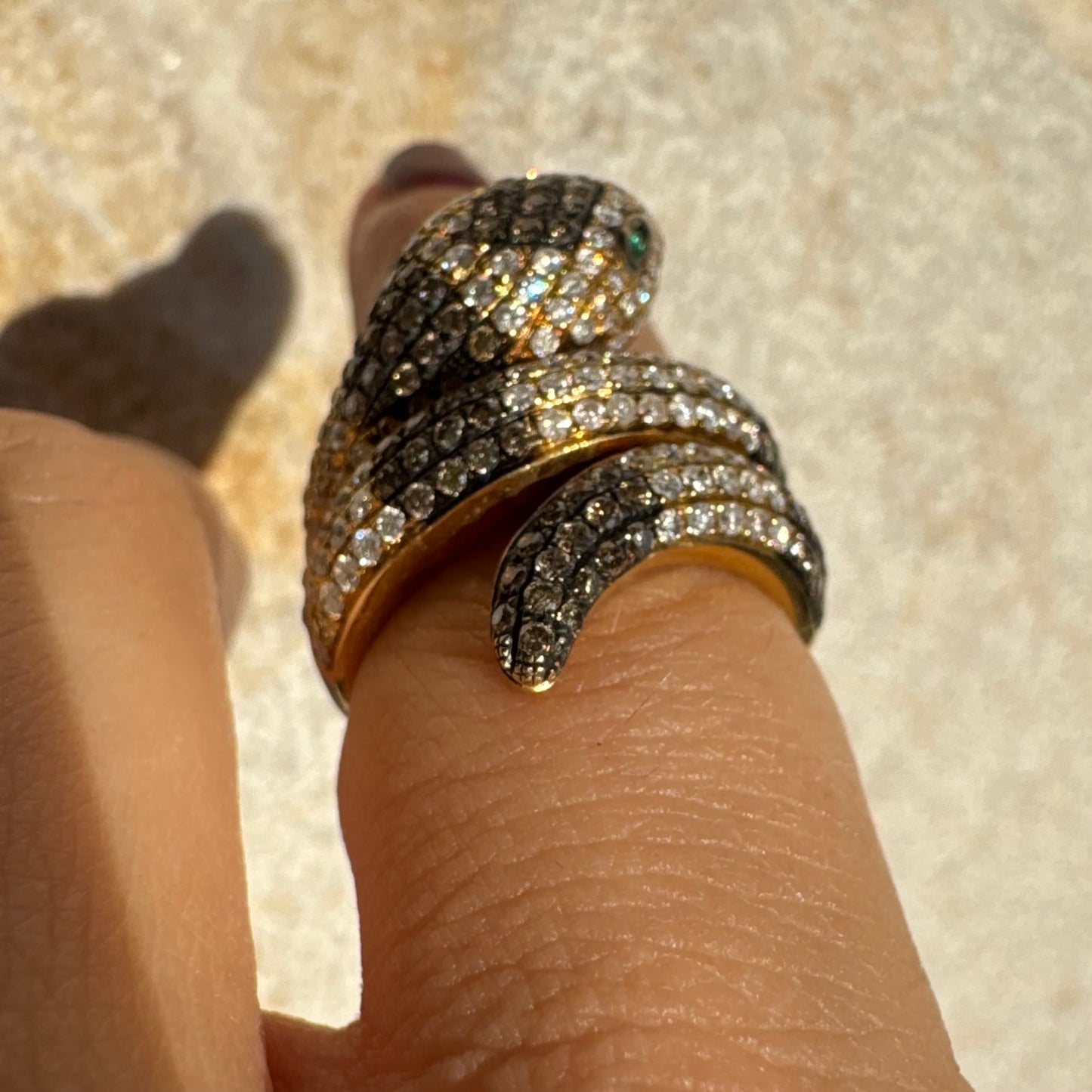 14K gold snake ring fully set with white and black Diamonds, creating a striking contrast and luxurious sparkle.