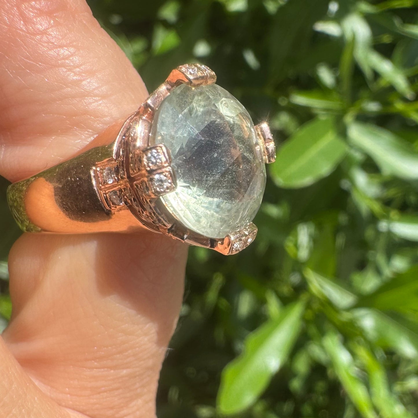 18K gold ring set with a stunning faceted Prasiolite, delicately accented with Diamonds on each prong