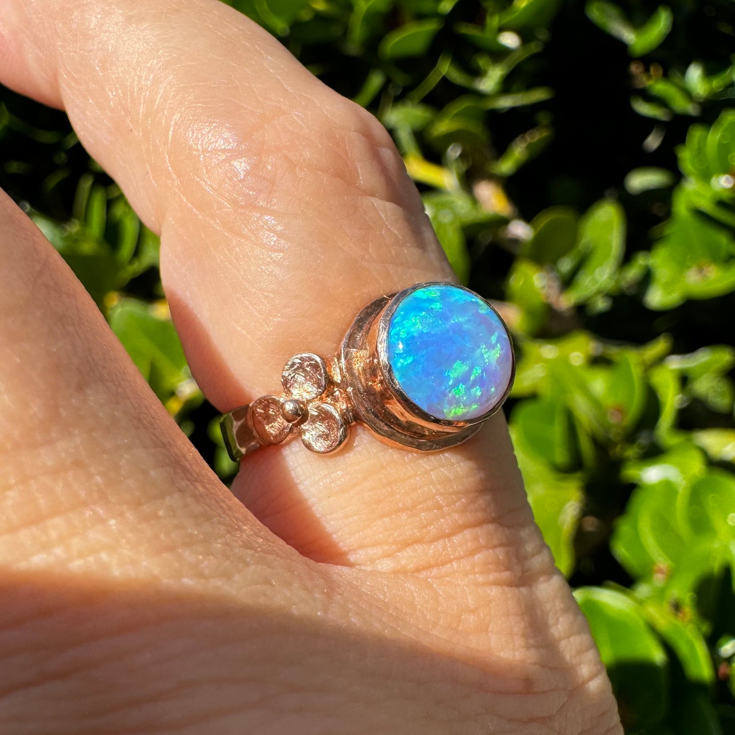 10K gold ring set with round Opal with vibrant flashes of blue, green and white
