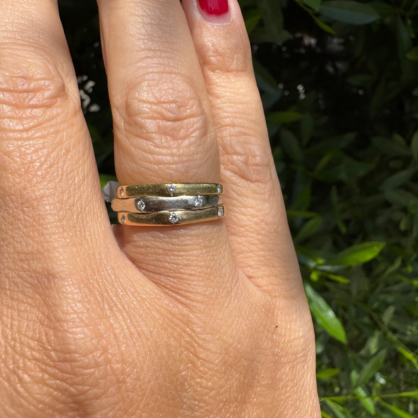 18K gold ring crafted in yellow, white, and rose gold, featuring a triple-band design set with Diamonds