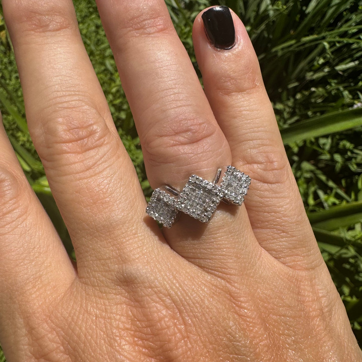 14K gold ring with three square clusters of sparkling Diamonds