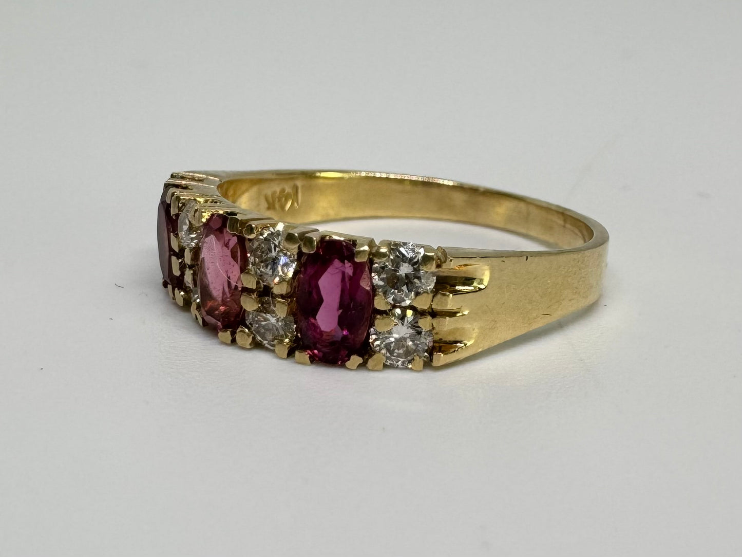 14K gold ring set with oval Pink Tourmalines and round brilliant-cut Diamonds