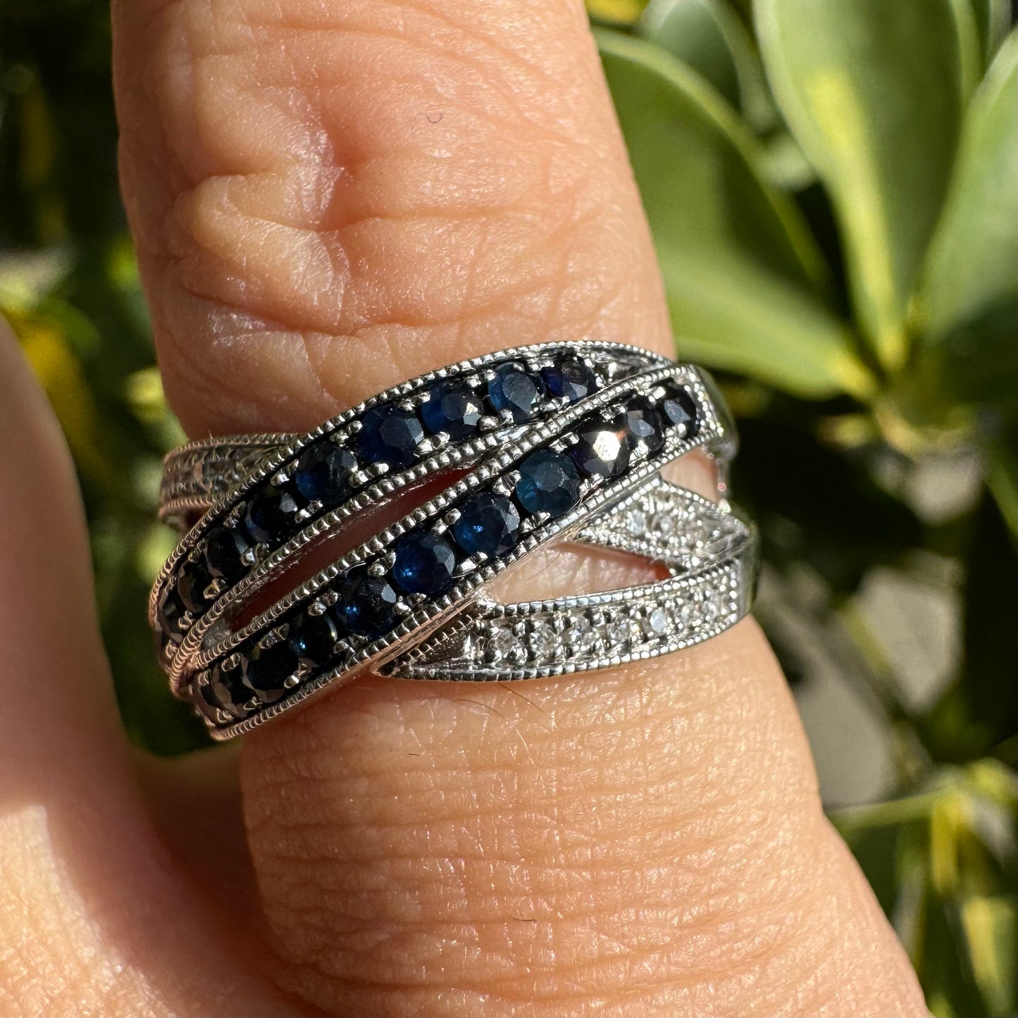 14K gold crossover ring set with Sapphires and sparkling Diamonds