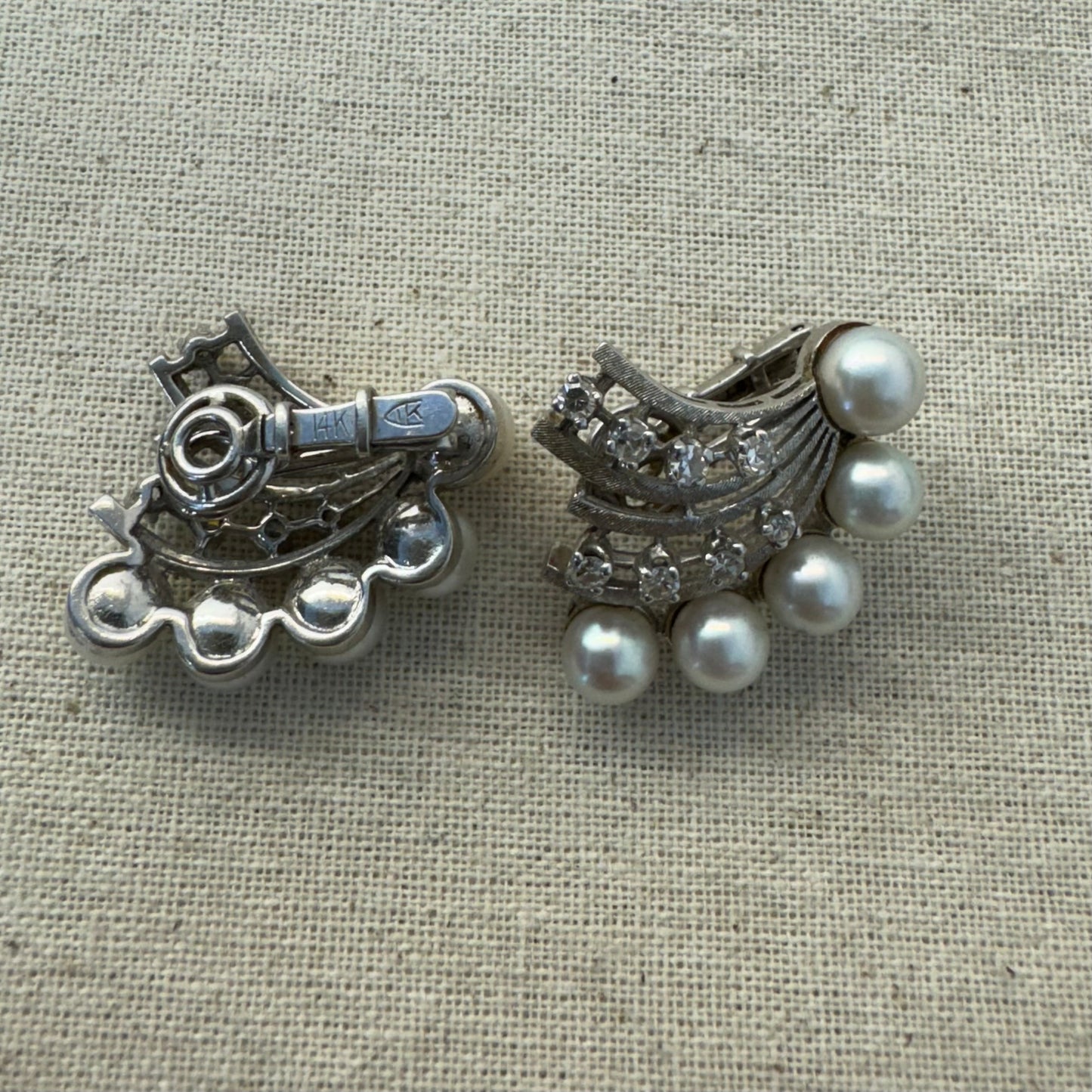 14K gold clip-on earrings inspired by 1950s Hollywood style, set with a row of luminous round pearls & Diamonds