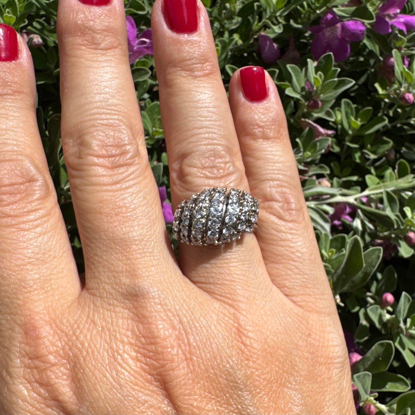 18K gold ring set with rows of sparkling Diamonds in a bold, sculptural design