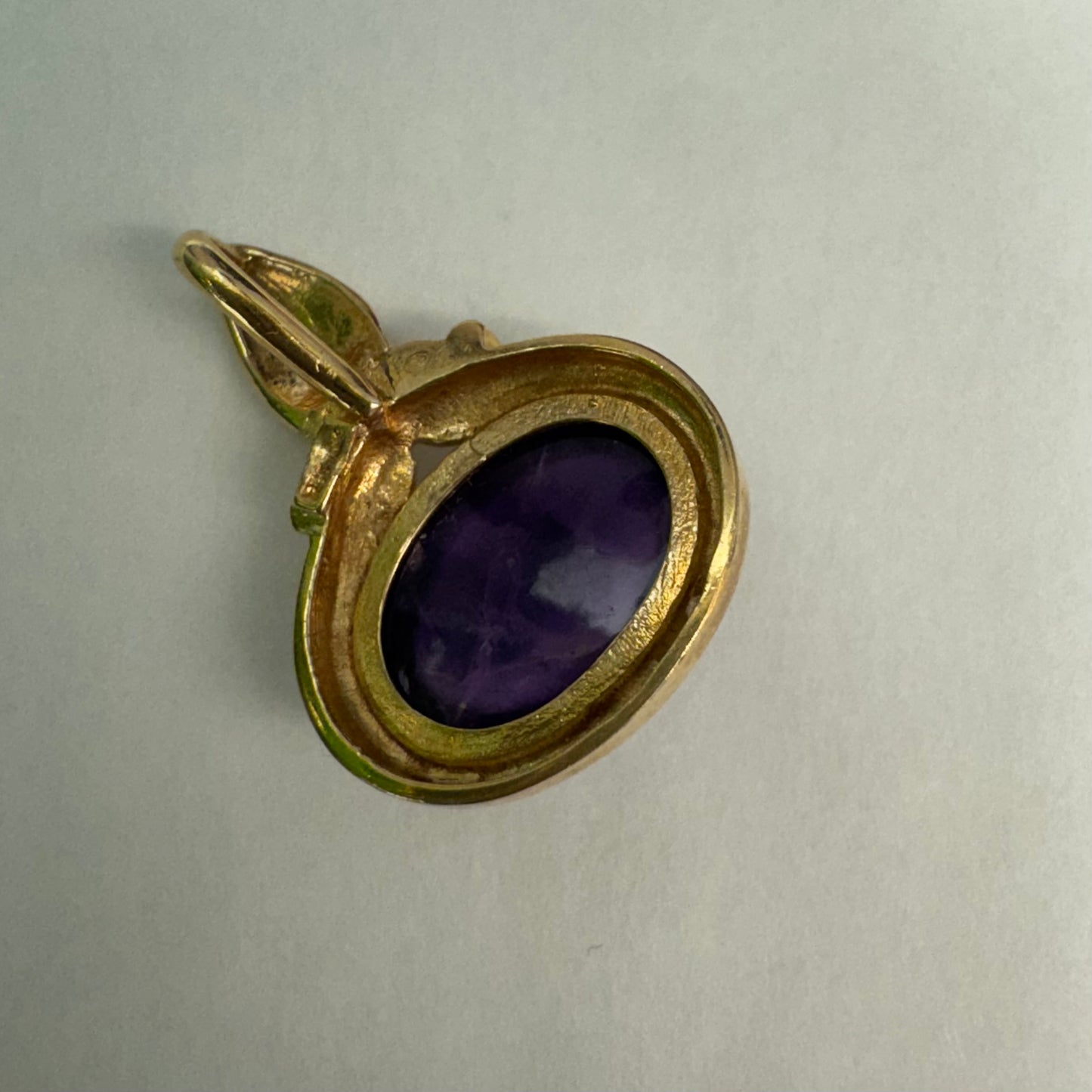 14K gold pendant set with a large cabochon Amethyst