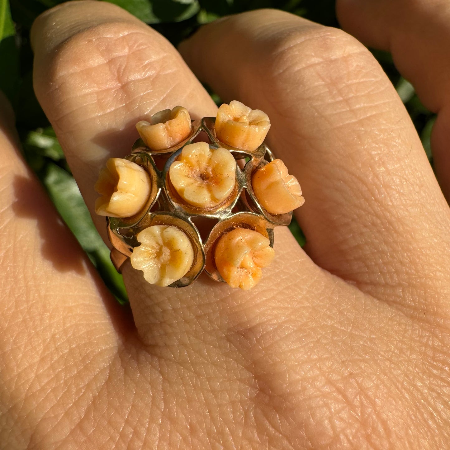 9K gold ring featuring a cluster design with carved Coral flowers in warm orange tones