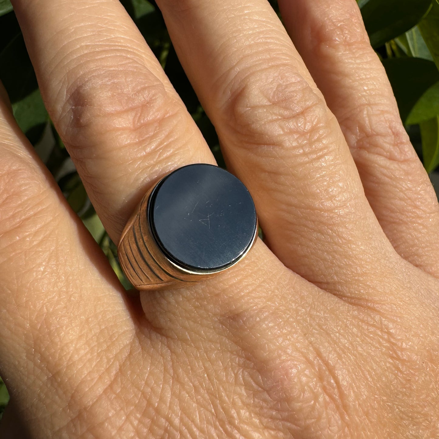 14K gold signet ring crafted in yellow gold, set with a smooth Black Onyx.