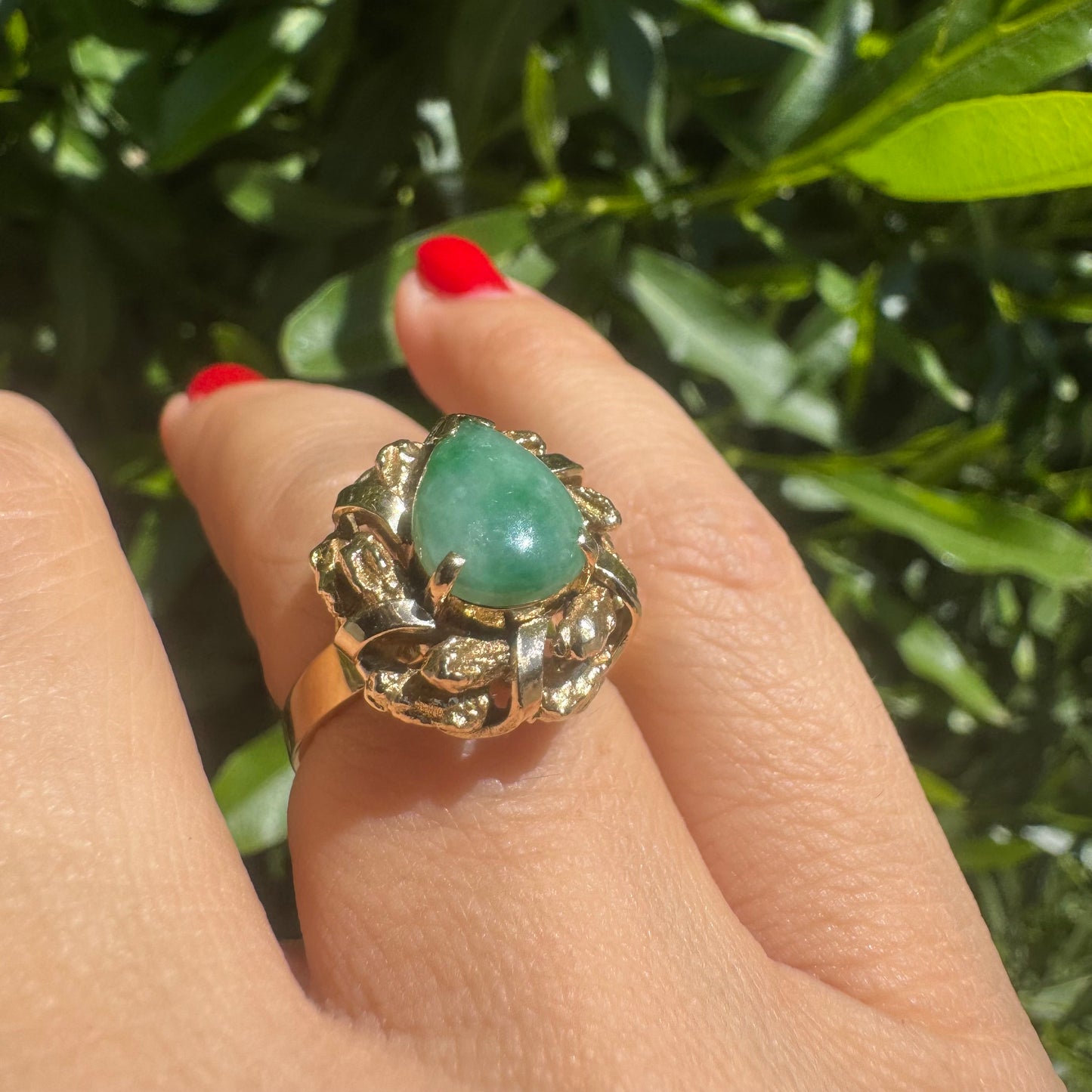 14K gold ring set with a pear-shaped Jade cabochon