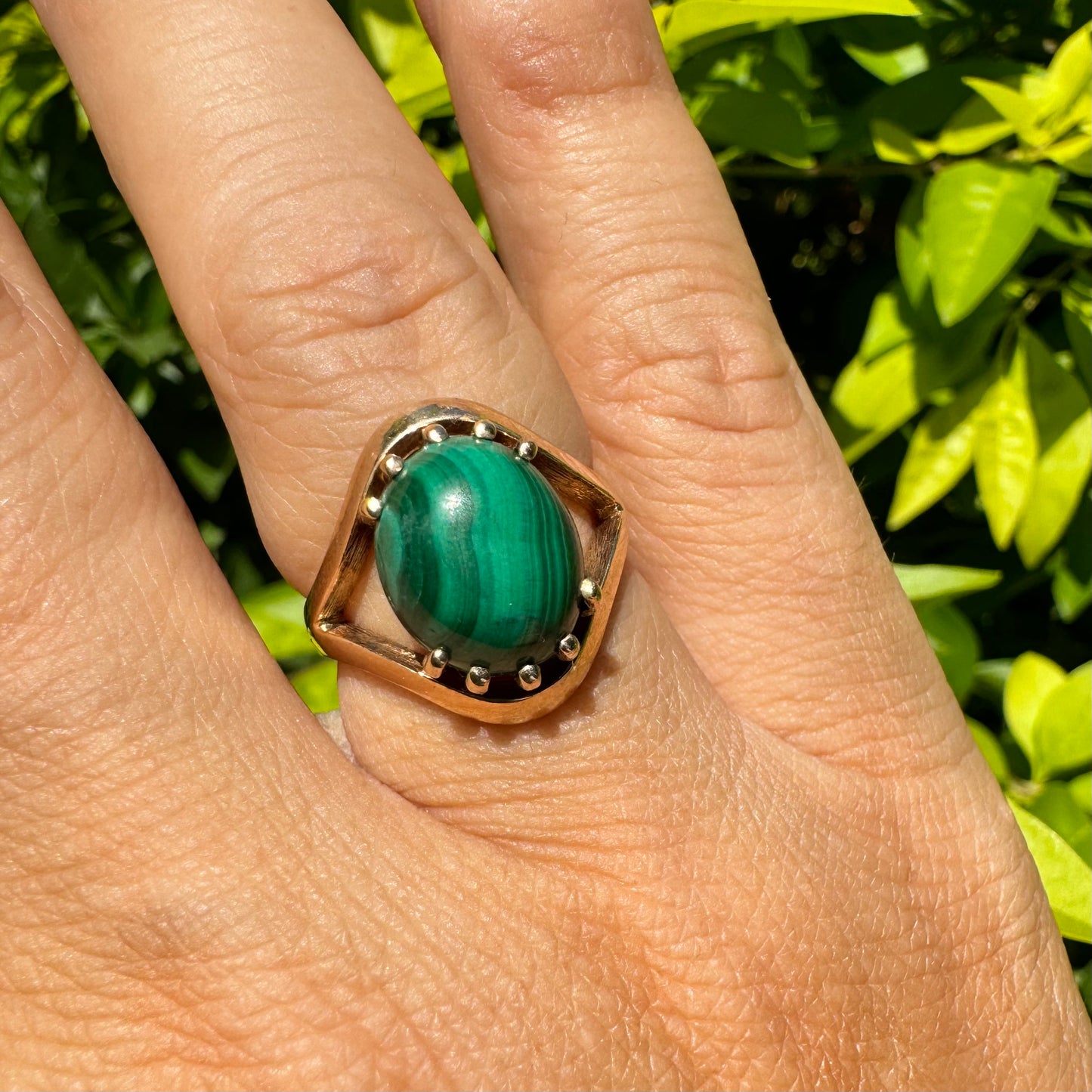 14K gold ring set with a polished Malachite cabochon
