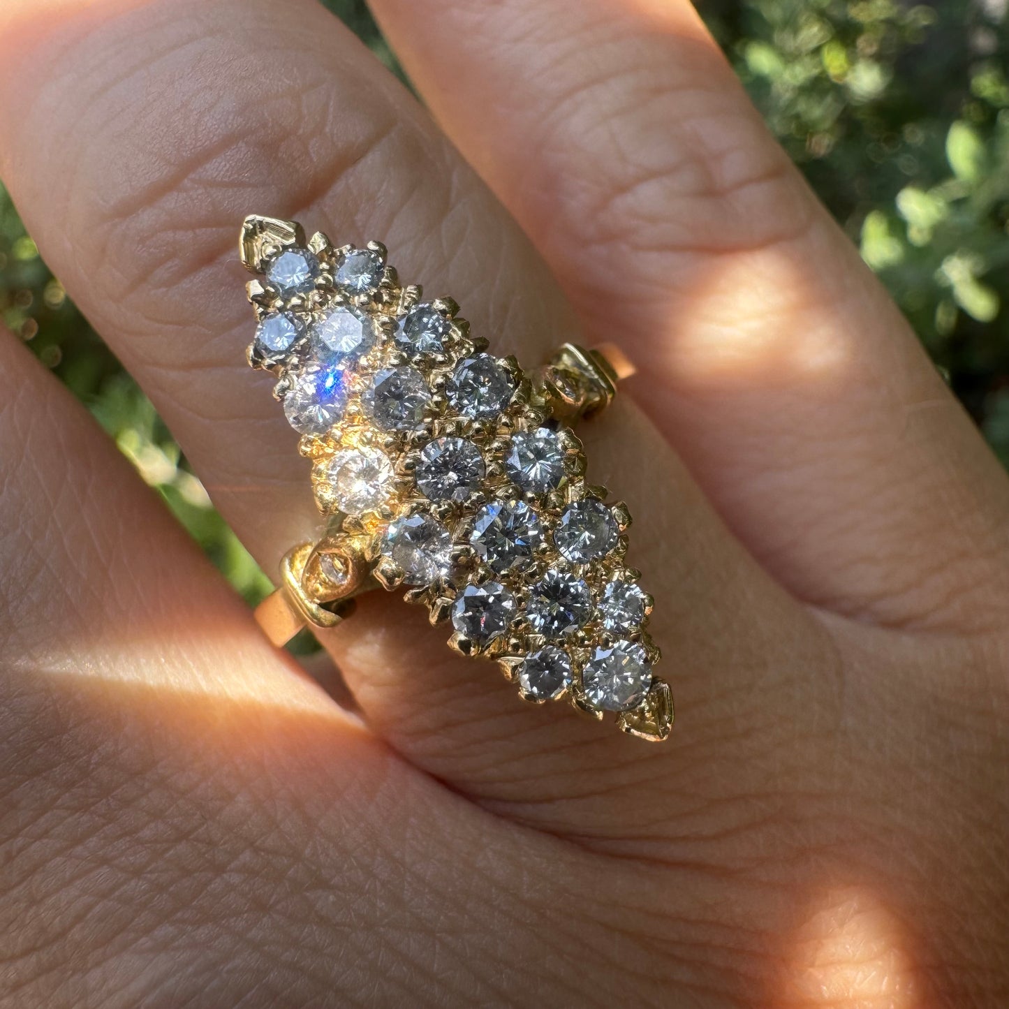 18K gold marquise-shaped ring set with multiple rows of sparkling Diamonds