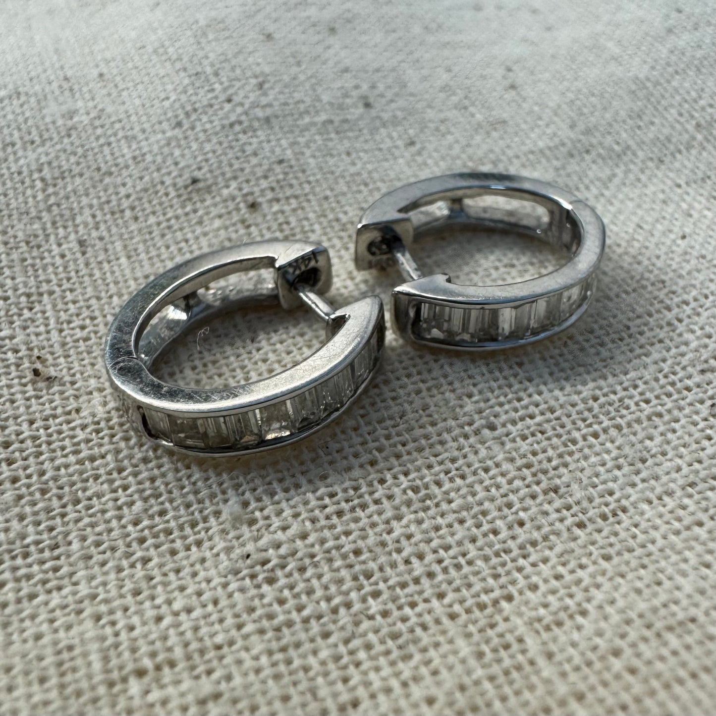 14K gold hoop earring set with a line of baguette-cut Diamonds