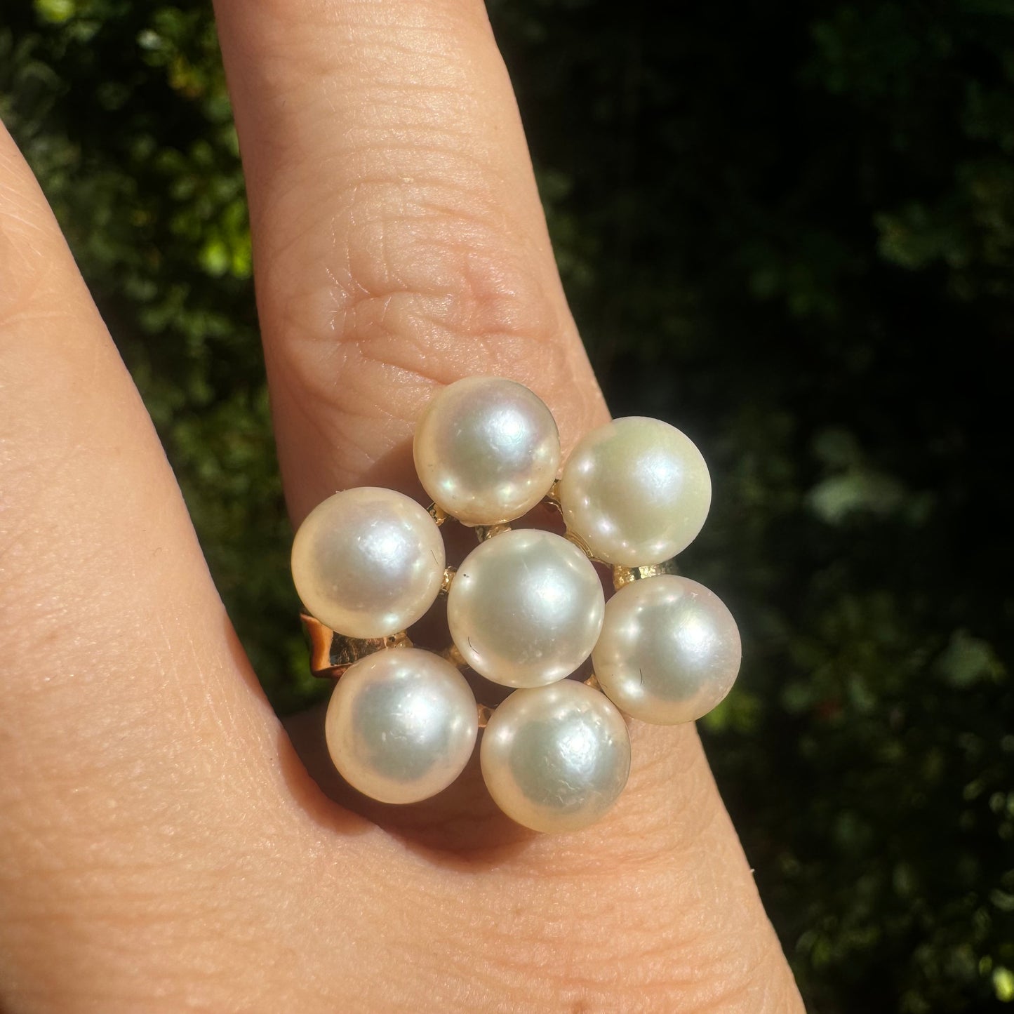 14K gold ring set with seven round Pearls in a bold floral cluster