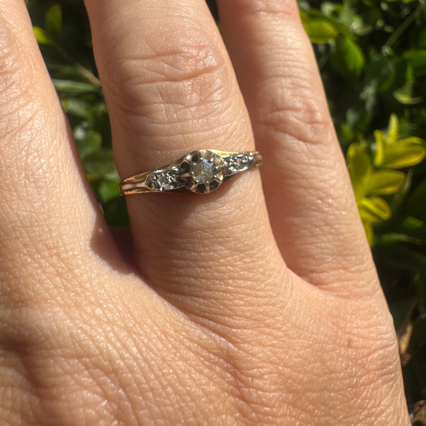 18K gold ring set with an old-cut center Diamond & side Diamonds