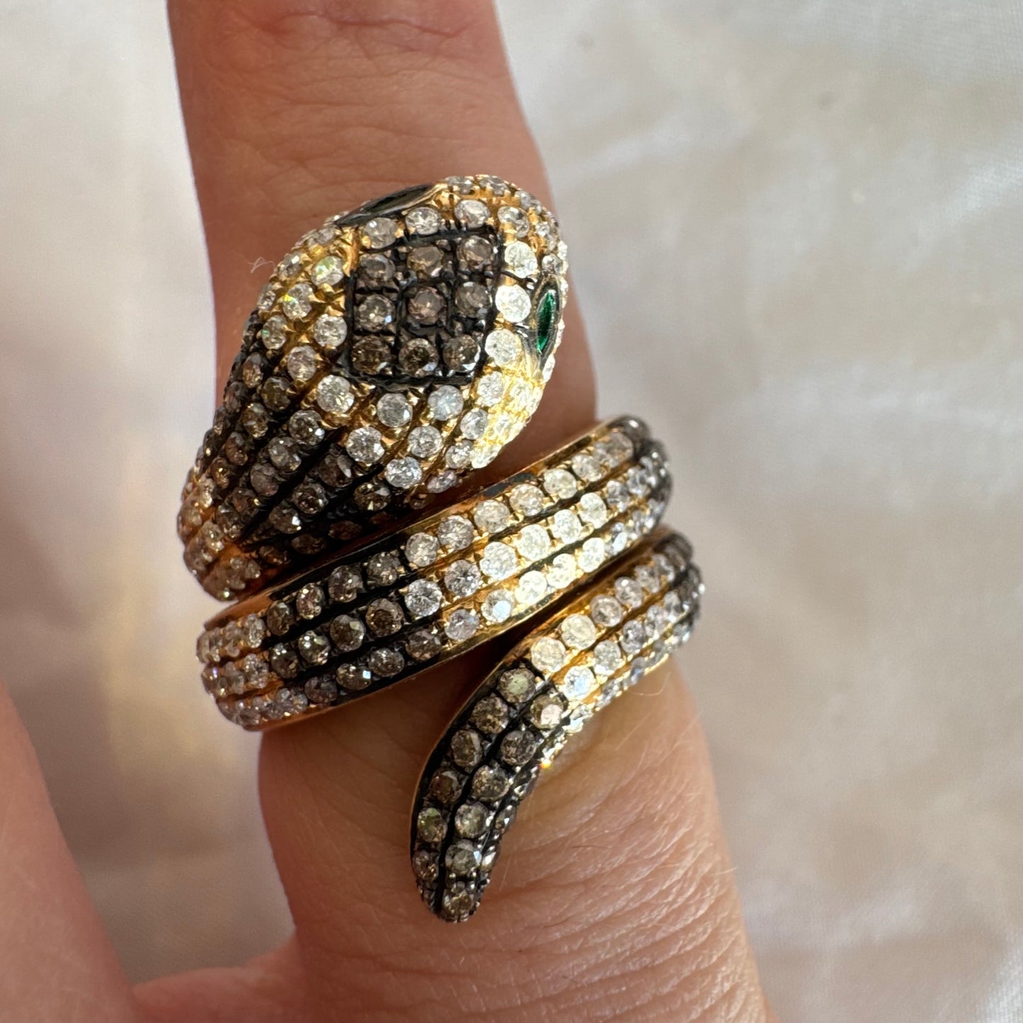 14K gold snake ring fully set with white and black Diamonds, creating a striking contrast and luxurious sparkle.