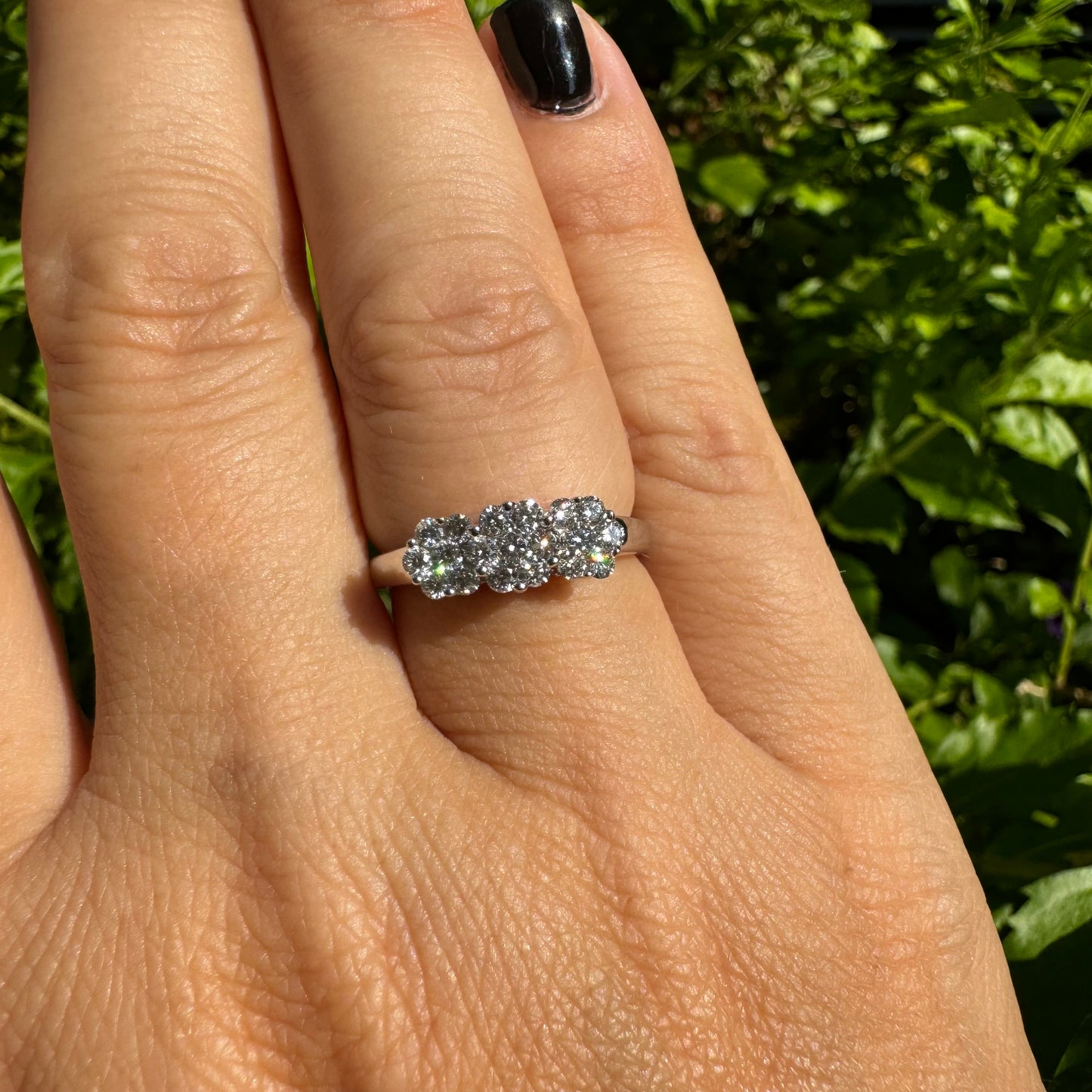 14K white gold ring set with clusters of brilliant white Diamonds