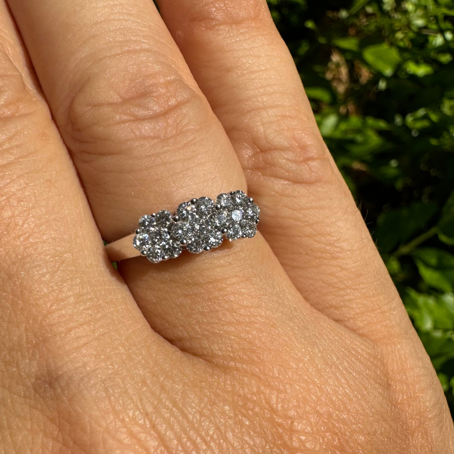 14K white gold ring set with clusters of brilliant white Diamonds
