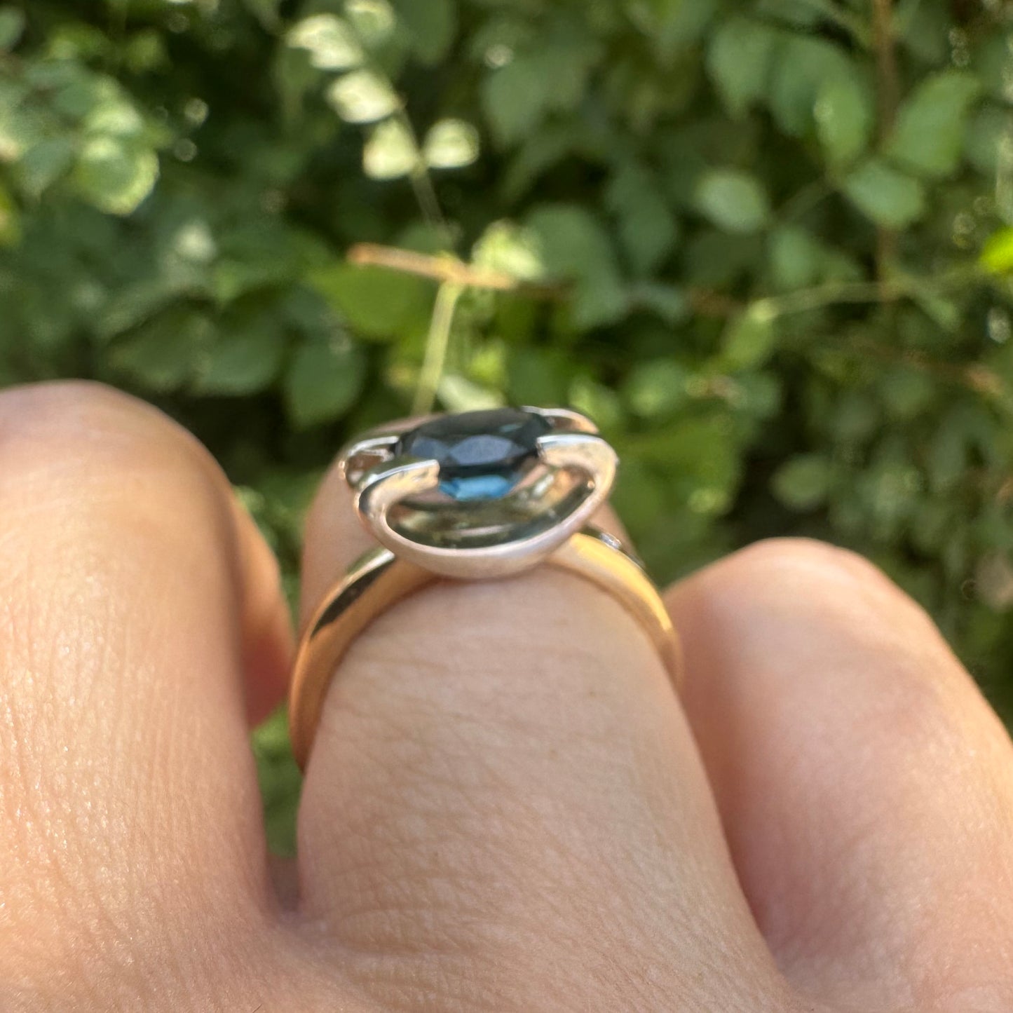 14K gold ring set with an oval-cut Blue Topaz “London”