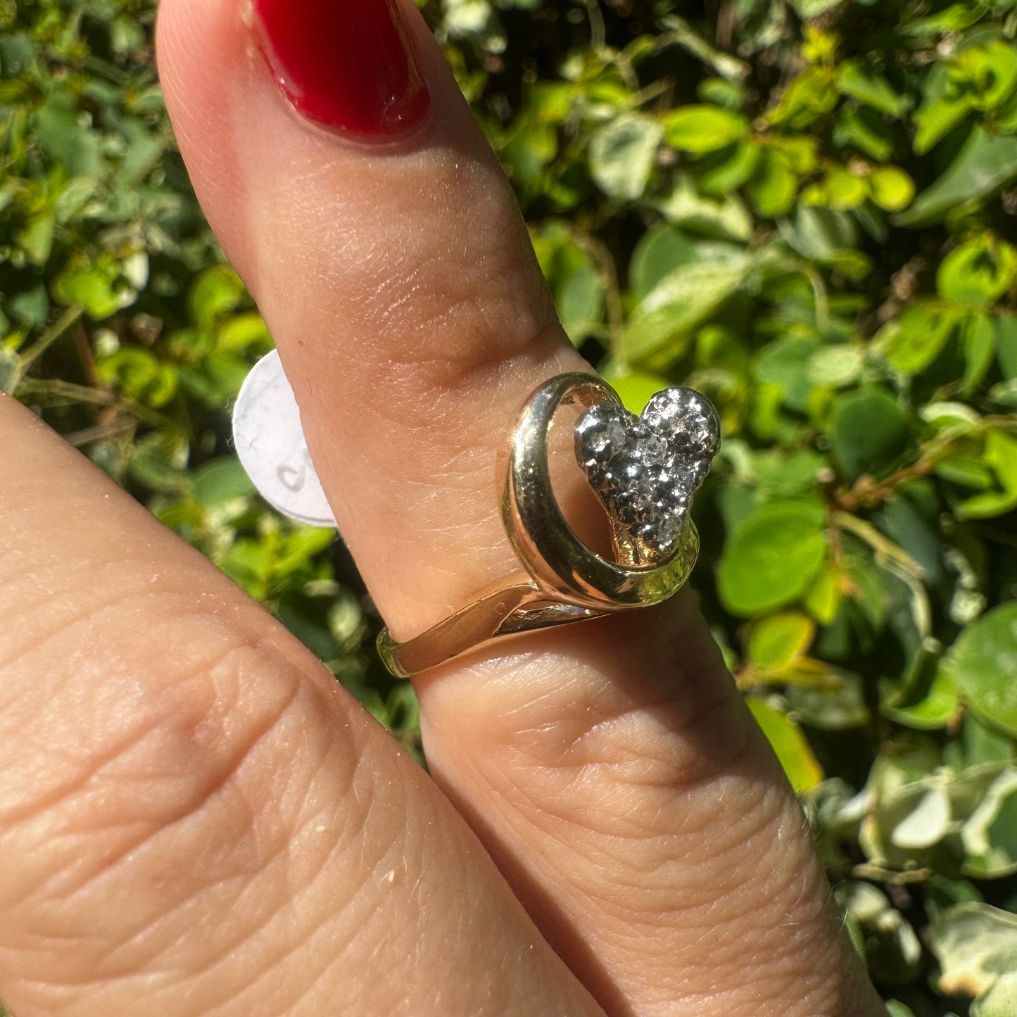 14K gold ring set with sparkling diamonds in a heart-shaped motif