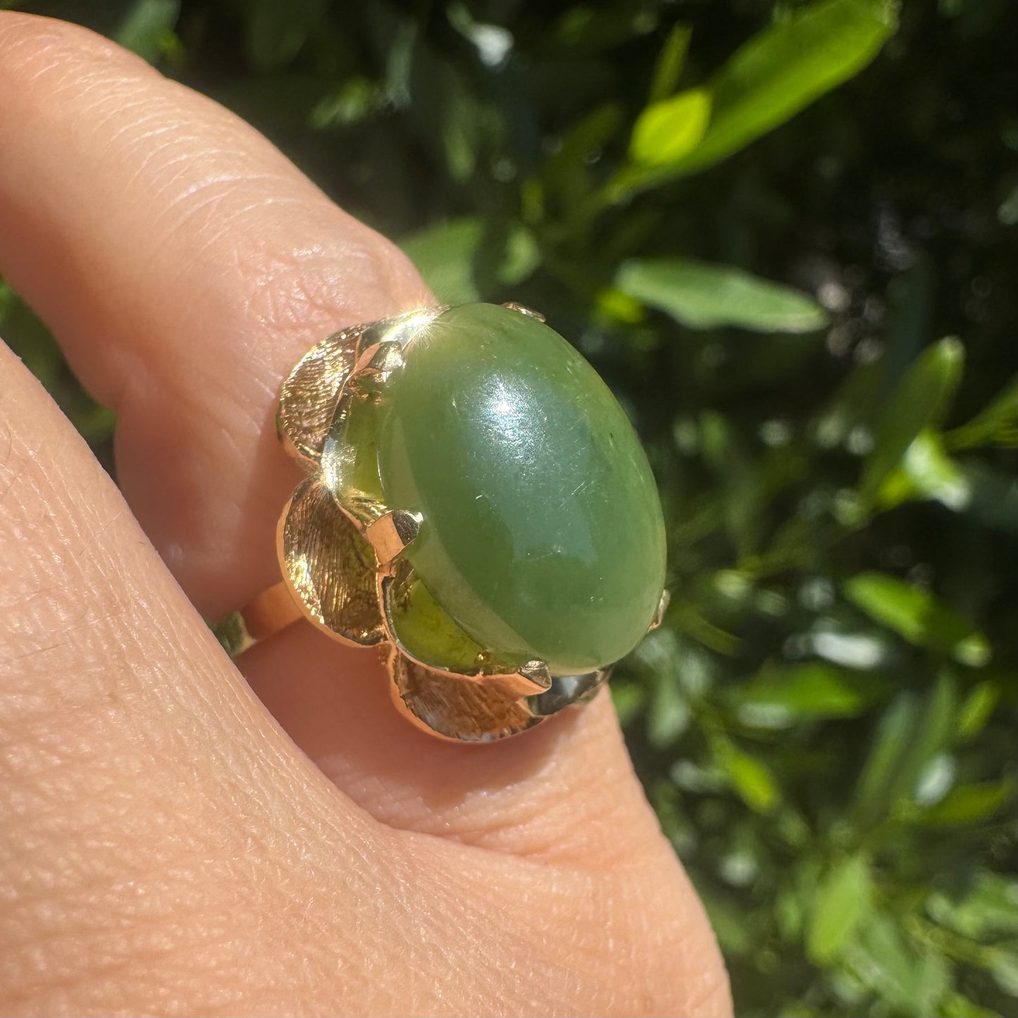 14K gold ring set with a large green Jade cabochon