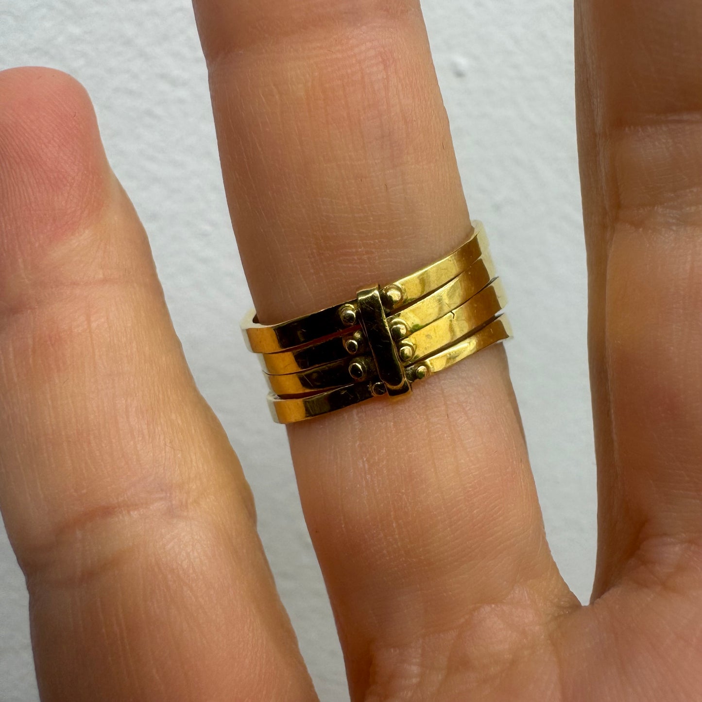 18K yellow gold ring set with vibrant rows of Sapphires, Emeralds, Rubies, and Diamonds