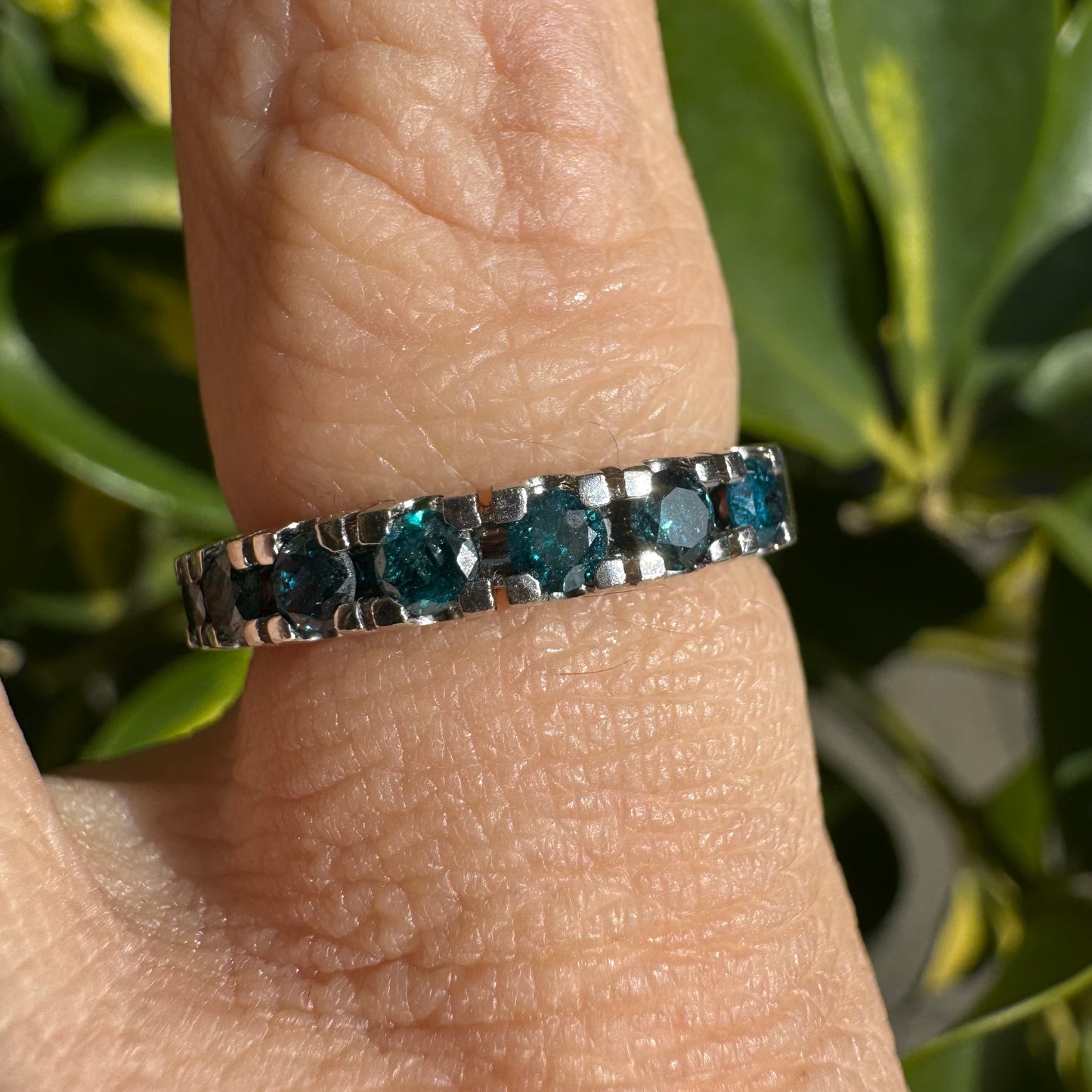 14K gold ring set with blue Diamonds