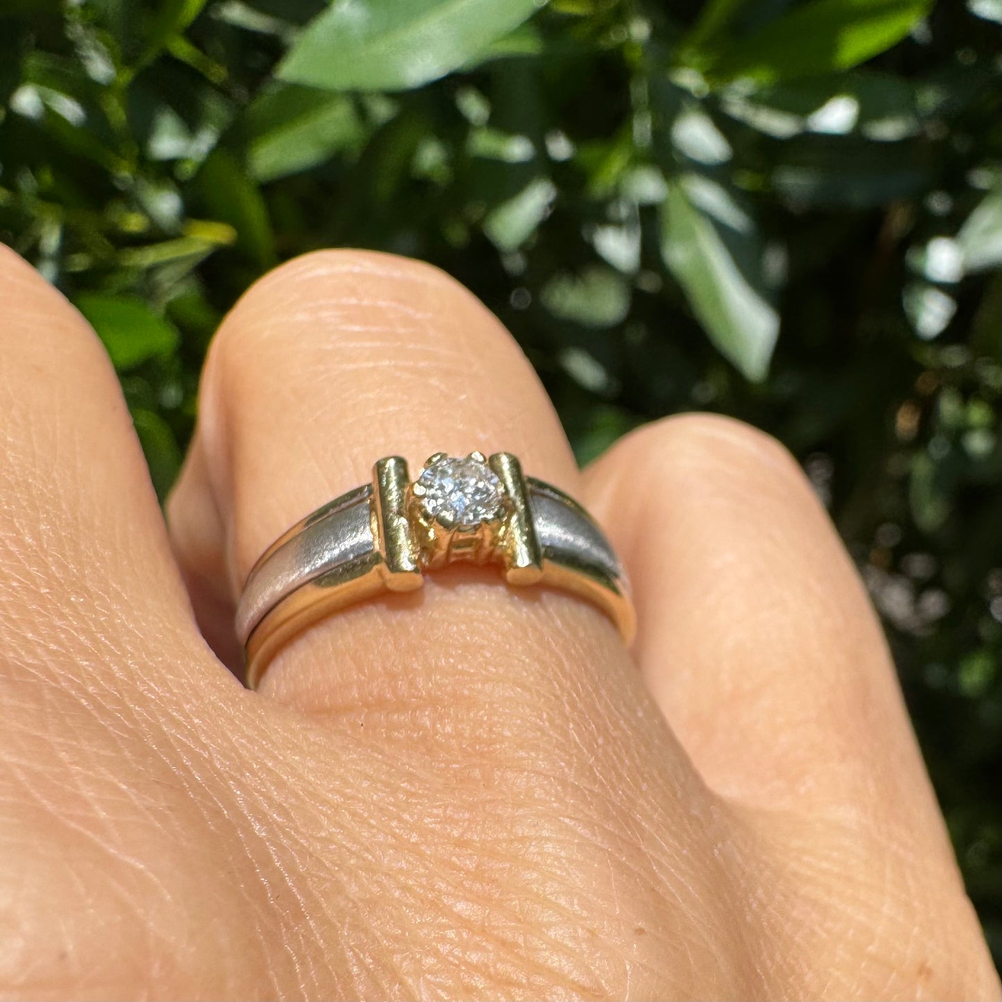 14K two-tone gold ring set with one center Diamond