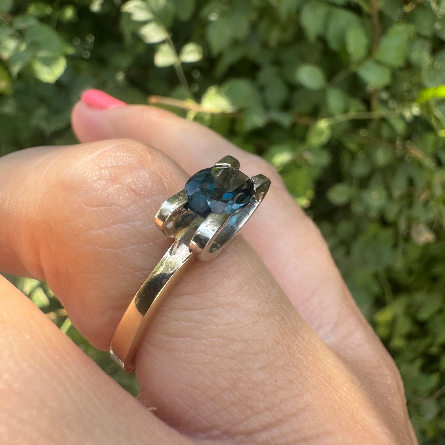 14K gold ring set with an oval-cut Blue Topaz “London”