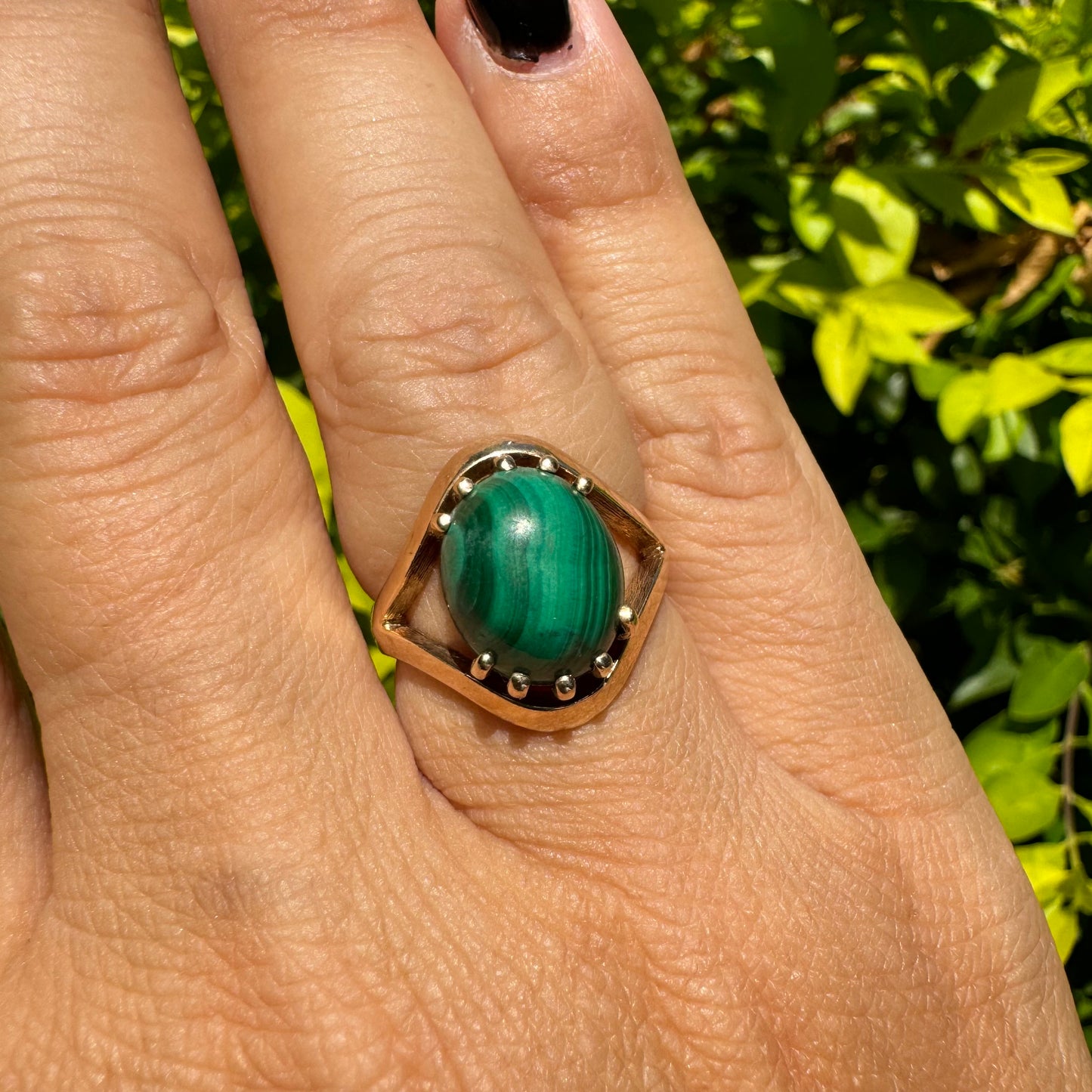 14K gold ring set with a polished Malachite cabochon