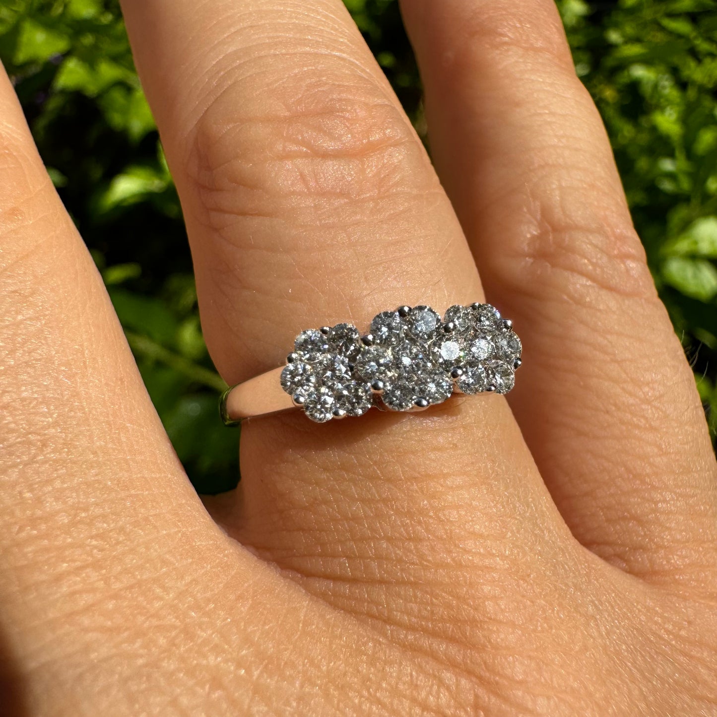 14K white gold ring set with clusters of brilliant white Diamonds