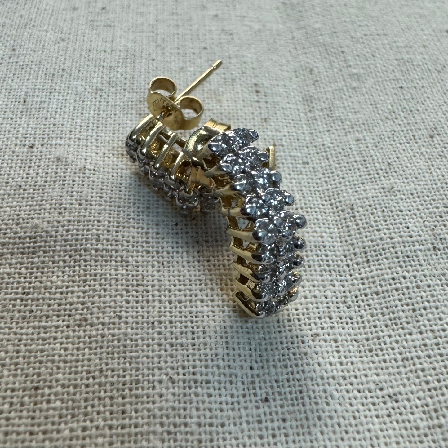 14K gold half-hoop earrings set with sparkling Diamonds in a dense pavé setting