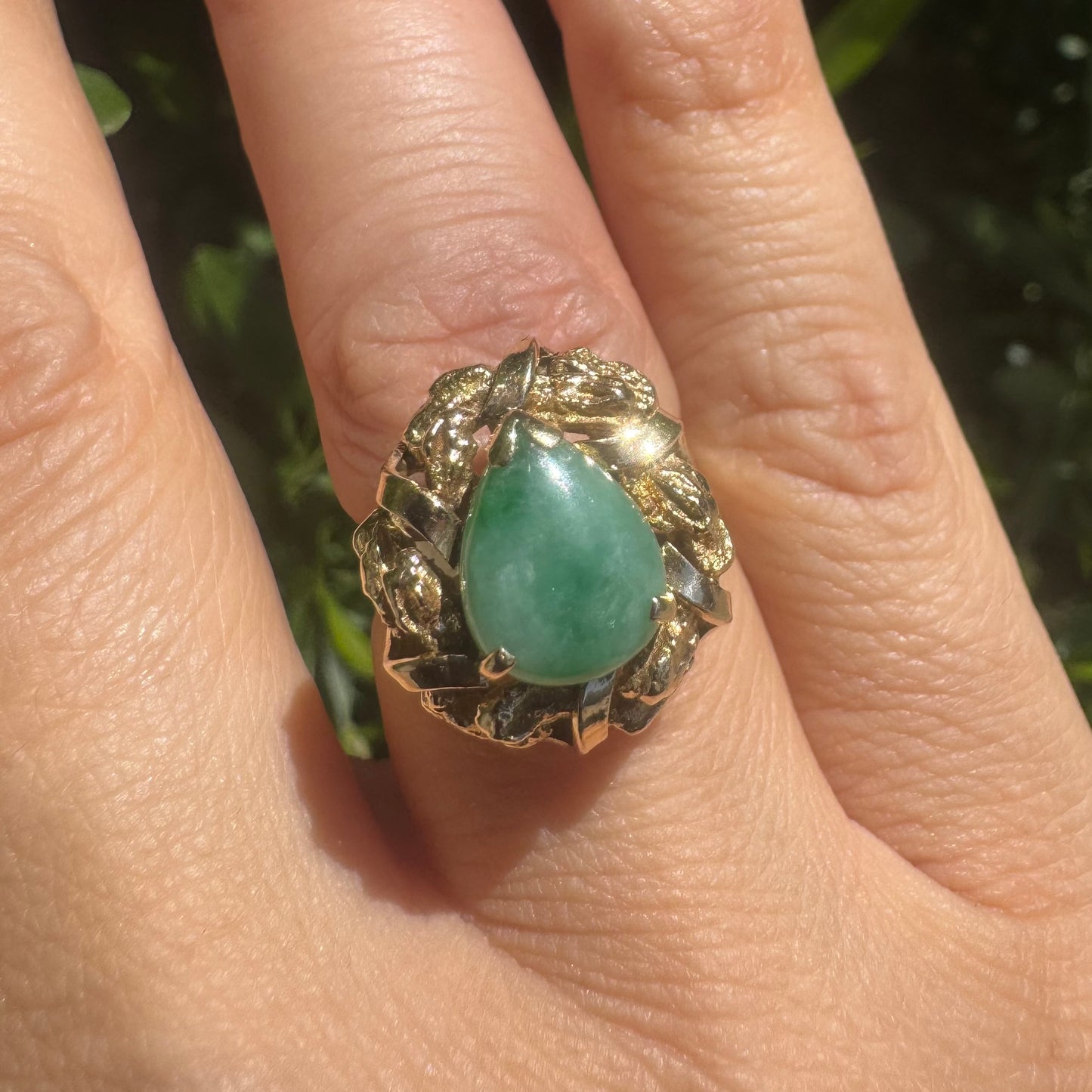 14K gold ring set with a pear-shaped Jade cabochon