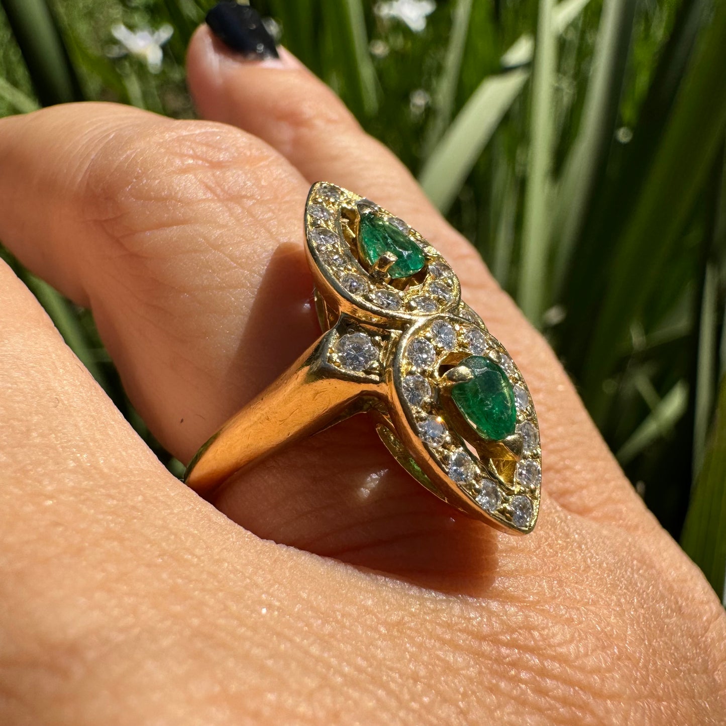 18K gold ring set with two pear-cut Emeralds & Diamonds