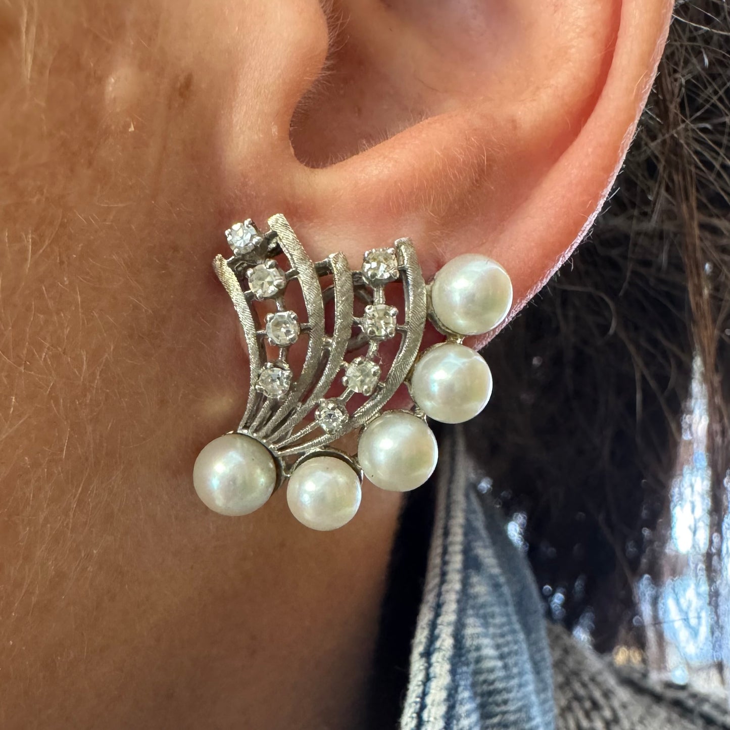 14K gold clip-on earrings inspired by 1950s Hollywood style, set with a row of luminous round pearls & Diamonds