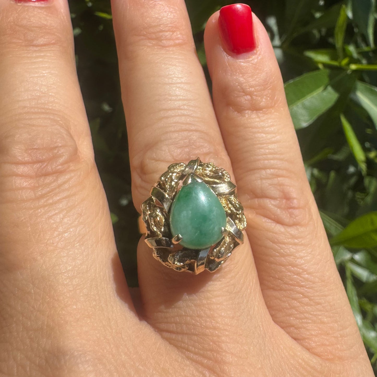 14K gold ring set with a pear-shaped Jade cabochon