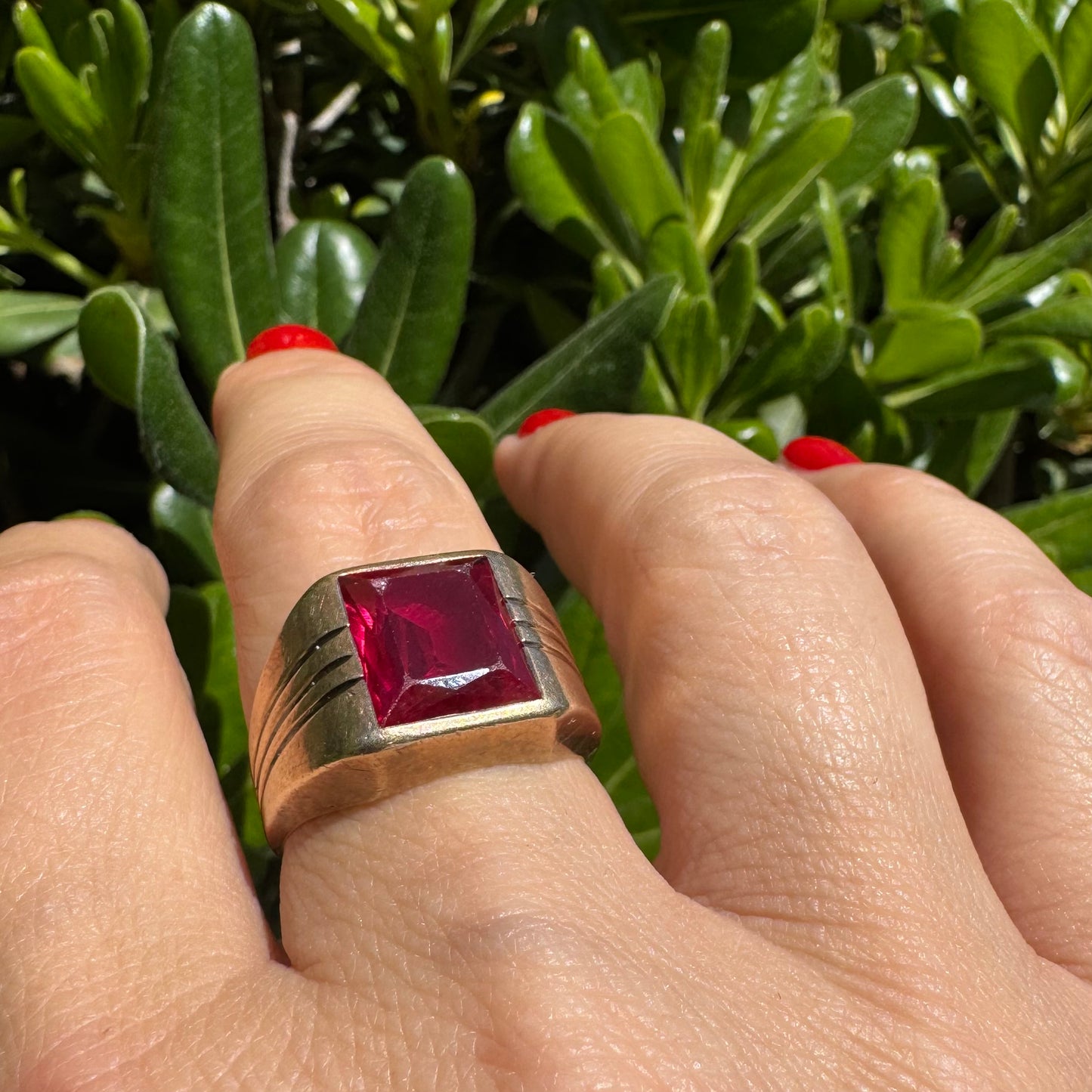 10K gold ring set with a bold red rectangular gemstone