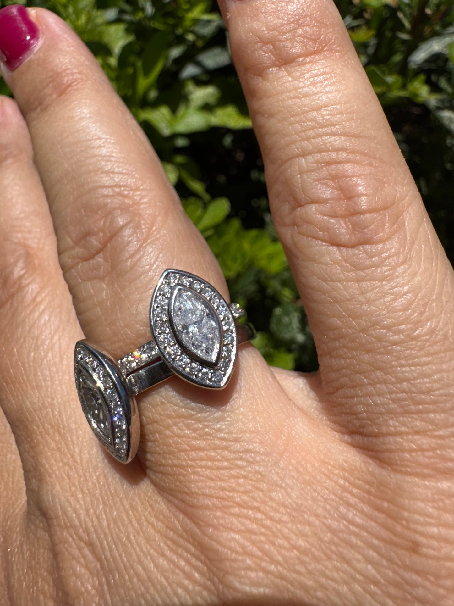 18K gold convertible ring set with two marquise-cut diamond halos that magnetically connect into a bold statement piece