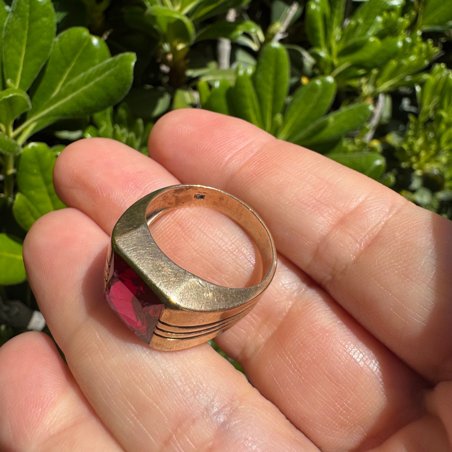 10K gold ring set with a bold red rectangular gemstone