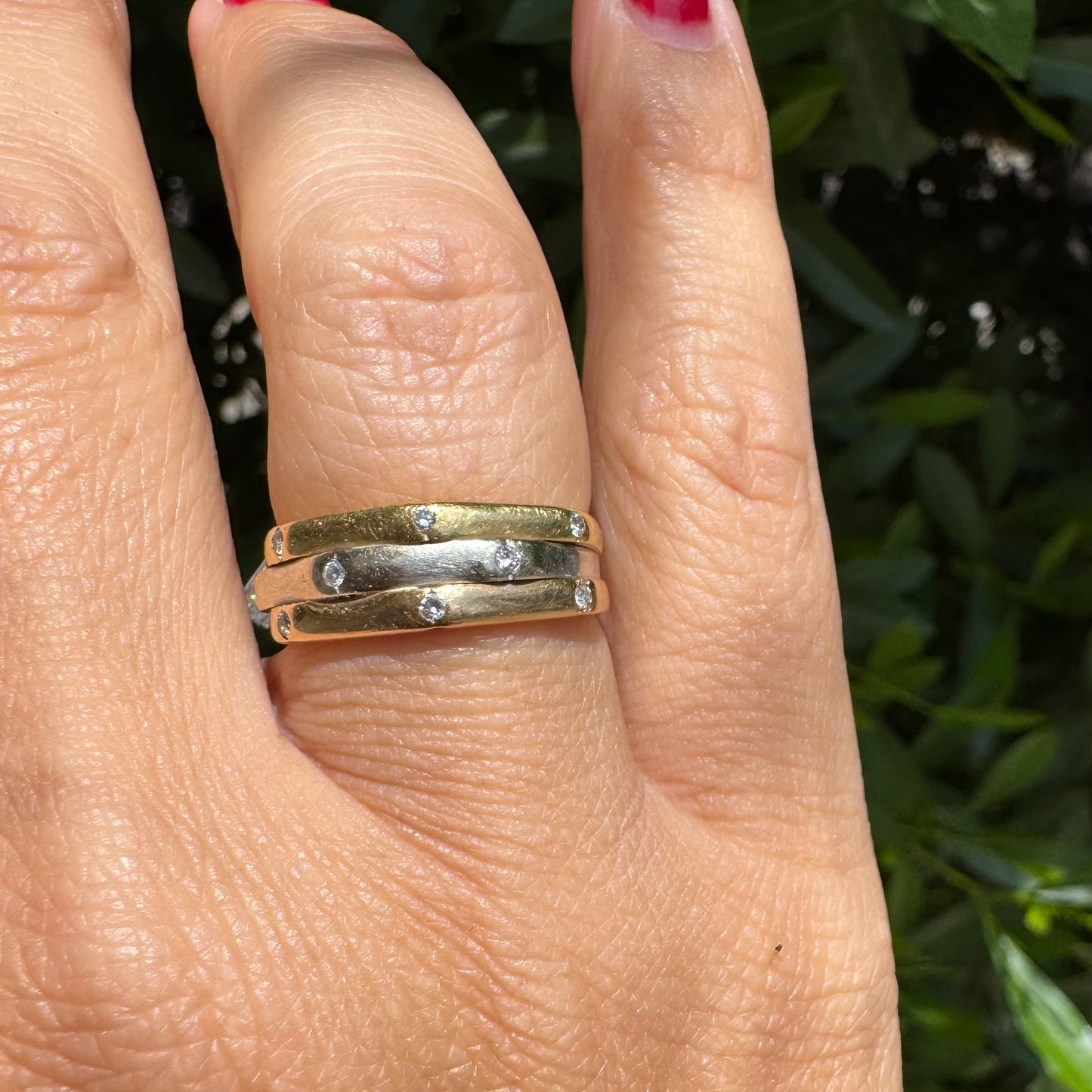 18K gold ring crafted in yellow, white, and rose gold, featuring a triple-band design set with Diamonds