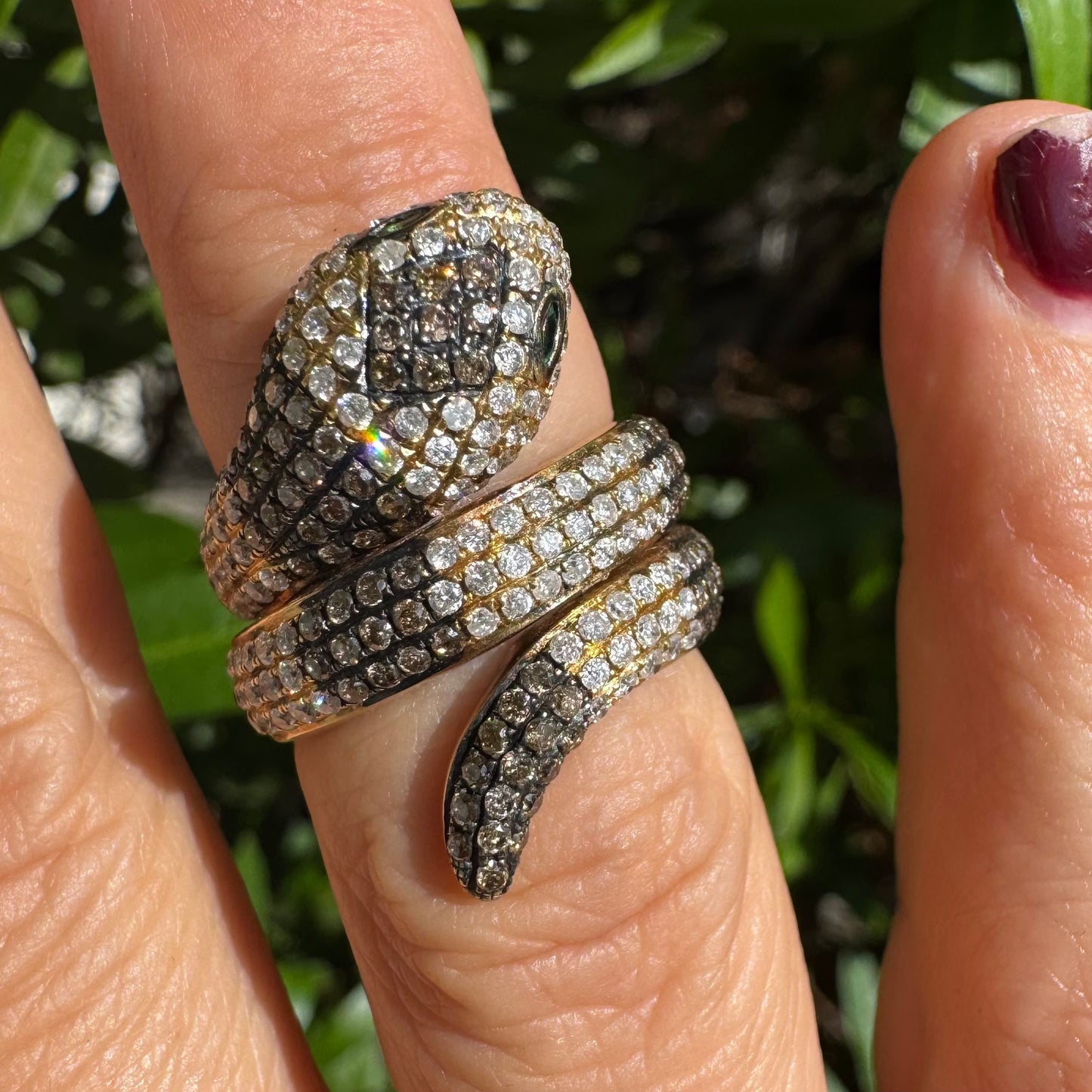 14K gold snake ring fully set with white and black Diamonds, creating a striking contrast and luxurious sparkle.
