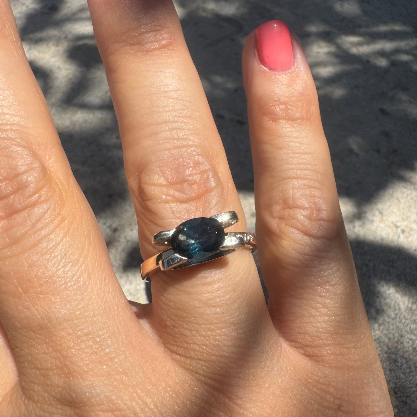 14K gold ring set with an oval-cut Blue Topaz “London”