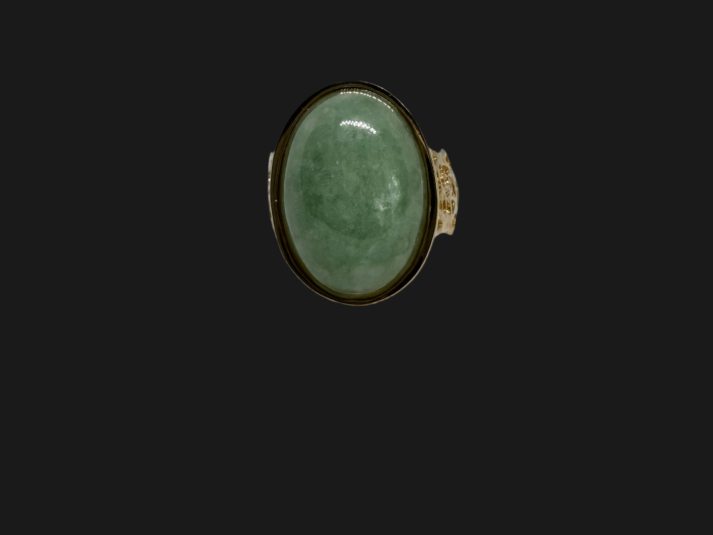 14K gold ring featuring a large oval light green Jade with a smooth polished finish, set in a classic bezel setting.