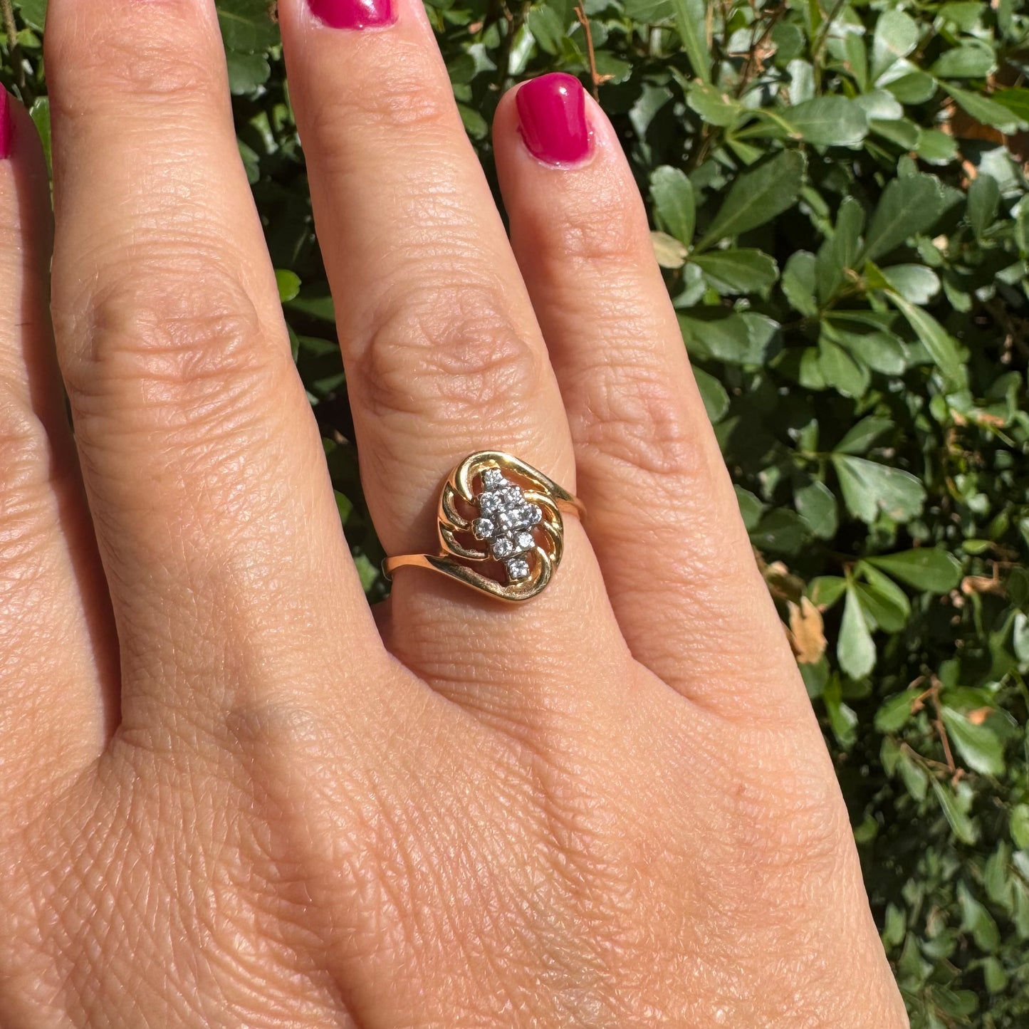 14K gold set with a cluster of sparkling Diamonds at its center